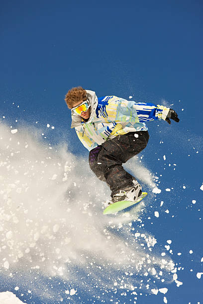 istock Snowboarder In Mid-Air Making Extreme Jump 118078494