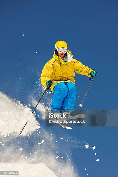 Skier In Midair Making Jump Against Blue Sky Stock Photo - Download Image Now - Adult, Adults Only, Adventure