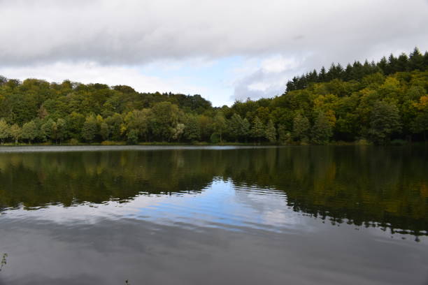 istock autumn at caldera lake Holzmaar 1180786401