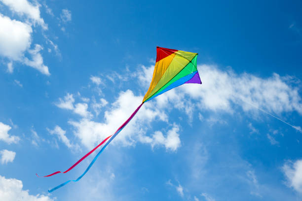 istock Kite flying in the sky among the clouds 1180787007