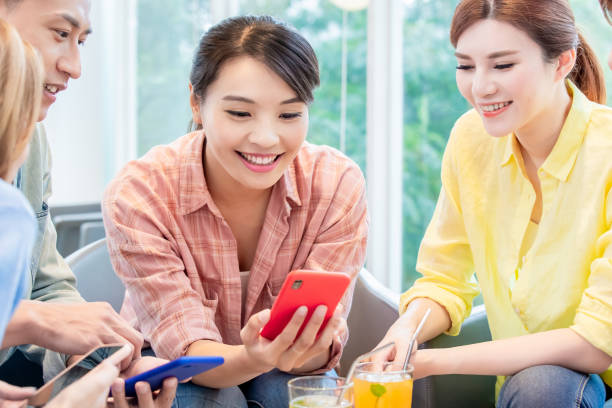 istock Asian friends use smart phone 1180787940