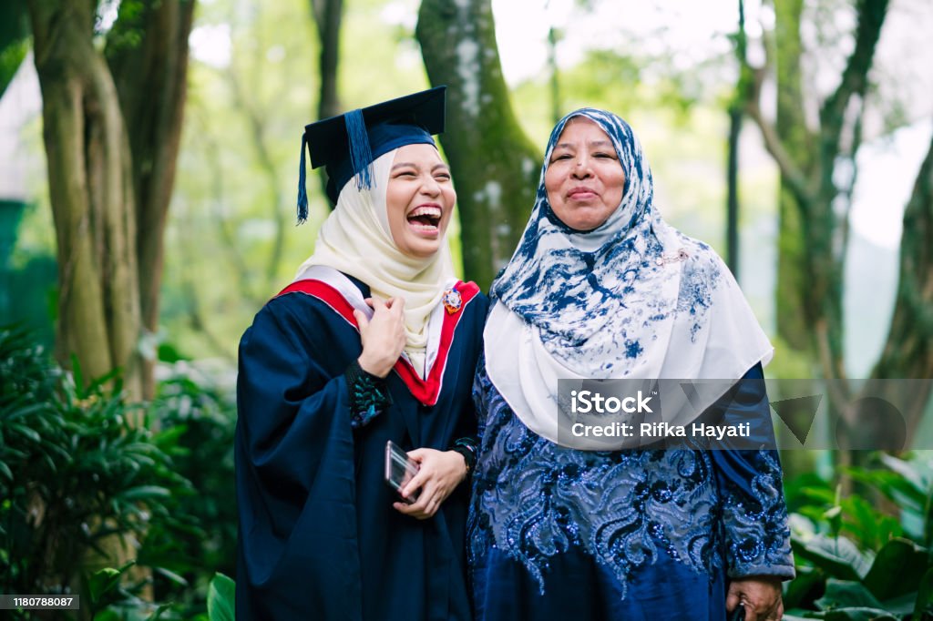 Portrait of Young Women Celebrating Graduation with Her Mother Graduation Day in Malaysia Graduation Stock Photo