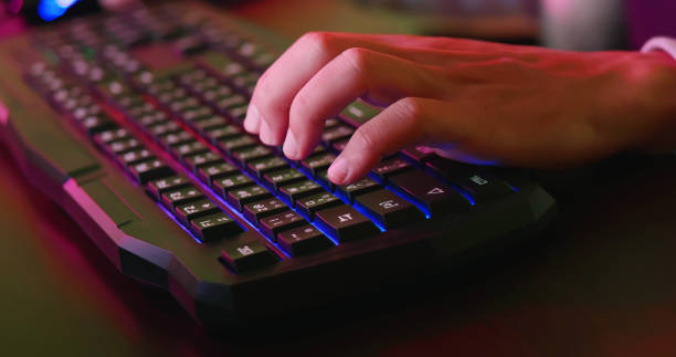 istock cyber sport gamer press keyboard 1180790763