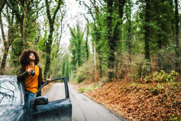 Woman in the woods during warm color fall