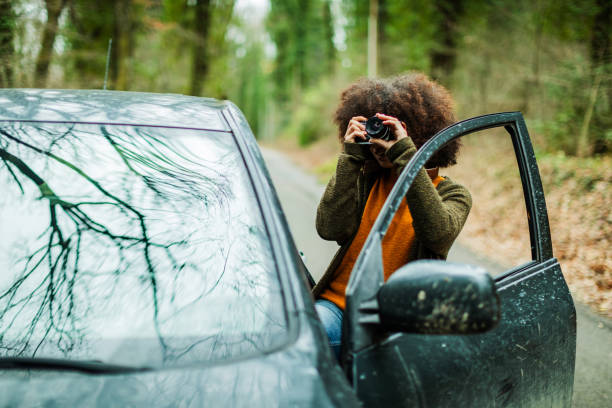 istock Woman in the woods during warm color fall 1180791571