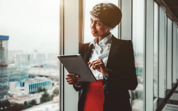 istock Biracial businesswoman and tablet pc 1180792461