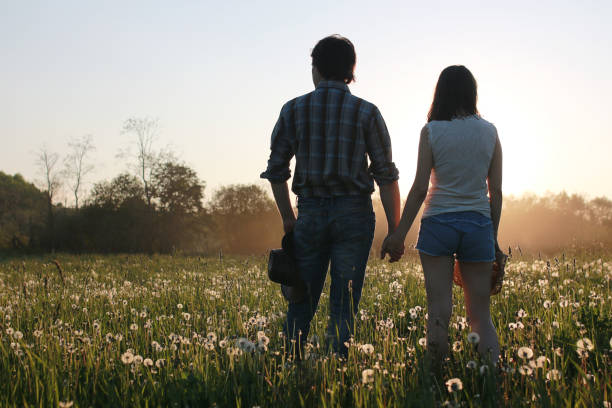 istock Cute couple on a walk by the countryside 1180793214