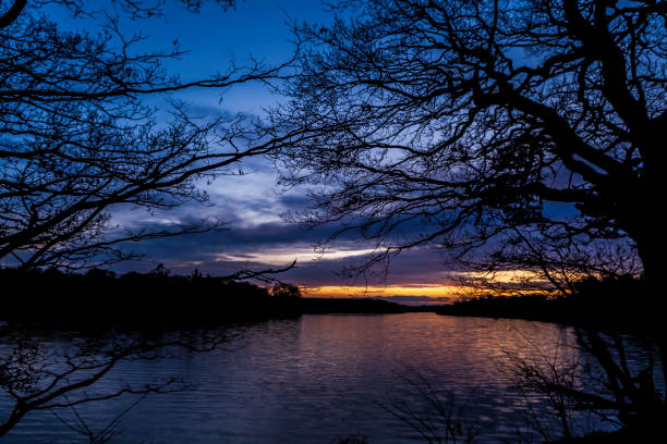 istock Winter sunset over Lake in Nottinghamshire, England 1180793480