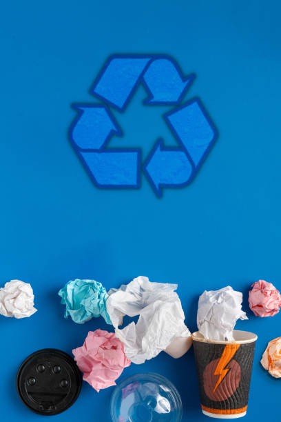istock symbol or icon of recycling, top view flat lay with some garbage 1180793783
