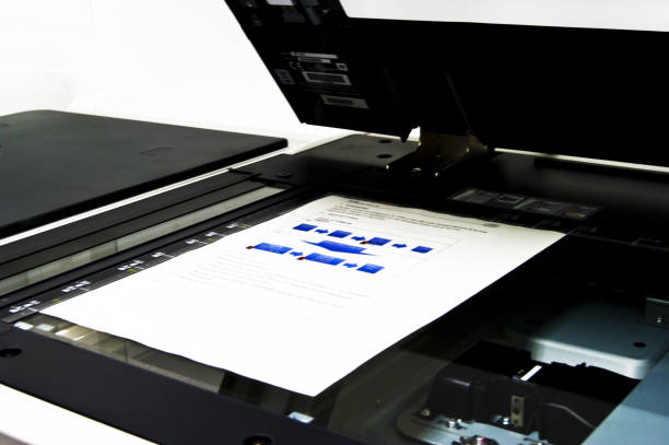 istock Copier with sheet of paper in close up view 1180795165