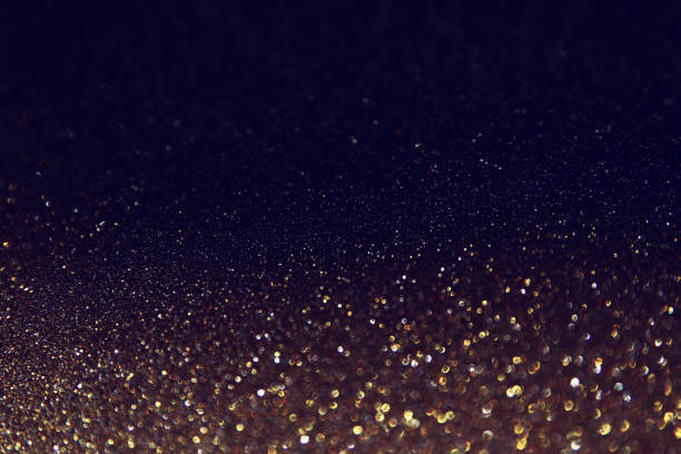 istock background of abstract glitter lights. gold and black. de focused 1180797660