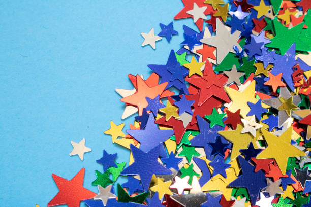 istock Glitter Tinsel Stars Close Up For Background 1180797739