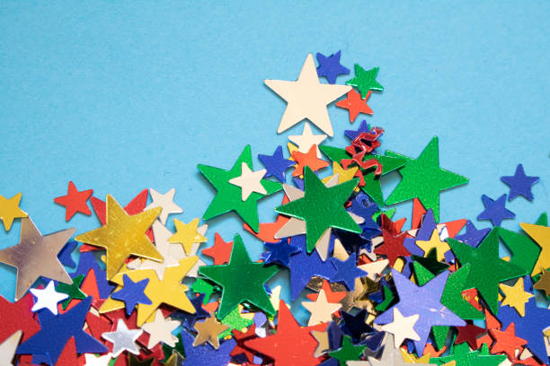 istock Glitter Tinsel Stars Close Up For Background 1180798368