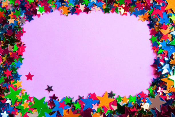 istock Glitter Tinsel Stars Border Frame Close Up For Background 1180798555