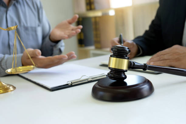 istock Judge or lawyer talking  with team or client 1180798605