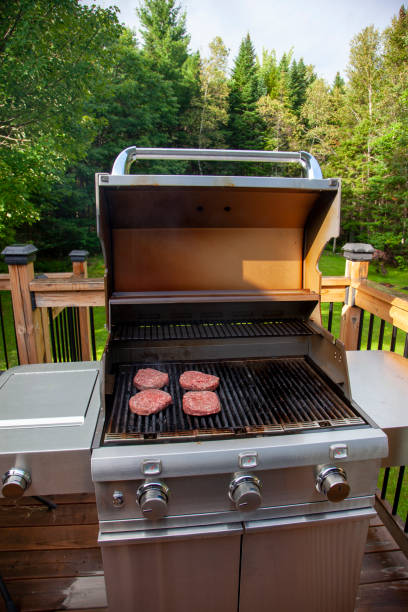 istock beef patties cooking on the barbeque 1180798756