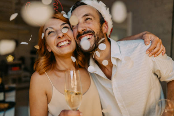 istock Smiling couple on New Year's Eve 1180799460