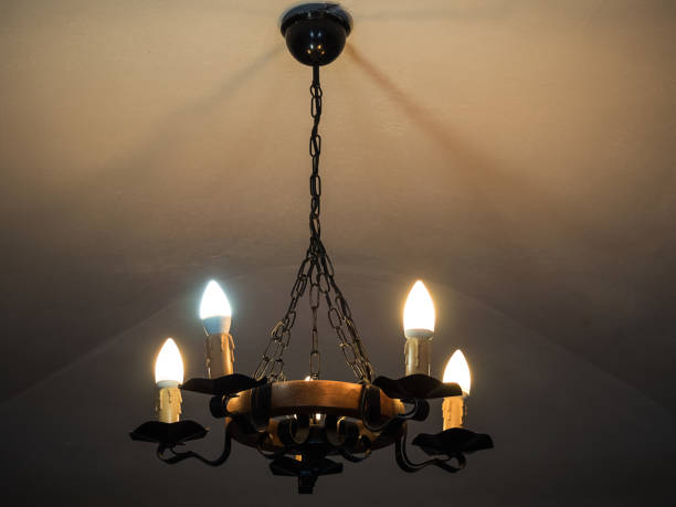 istock vintage chandelier shines in the dark 1180800325