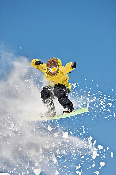 istock Expert Snowboarder Posing In Mid-Air Jump 118080037
