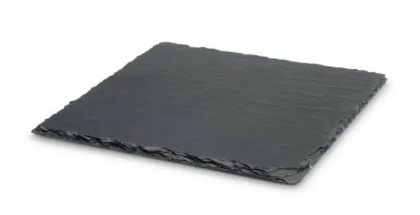 Photo of Empty black slate plate isolated on white