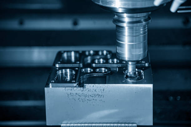 istock The CNC milling machine rough cutting the mould parts with the solid radius endmill tools. 1180802652
