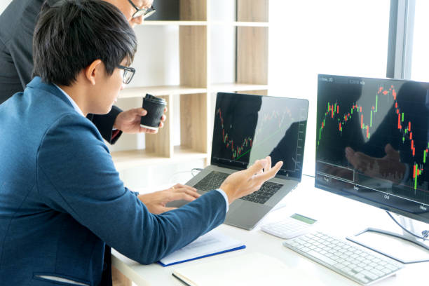 istock business man and woman sit at the table 1180802788