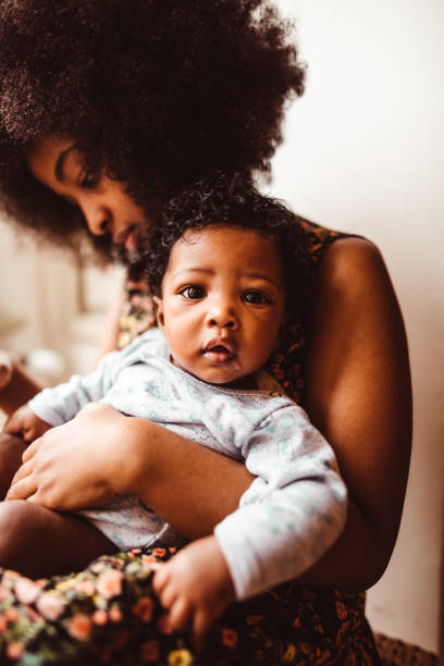 istock little daughter with mom 1180810693
