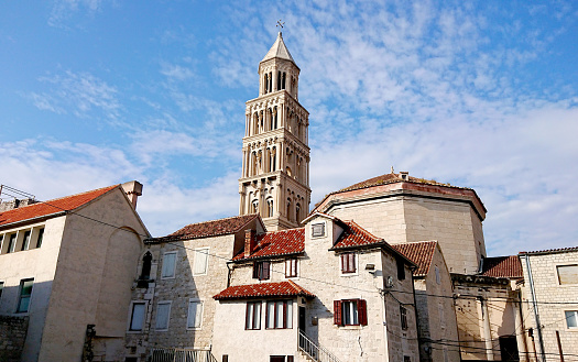 Bell Tower of the Saint Domnius cathedral in Split, Croatia. Marble ancient roman architecture in city downtown center of Split, view from below.