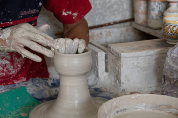 istock Close-up motion of hands making large ceramic vase 1180810986