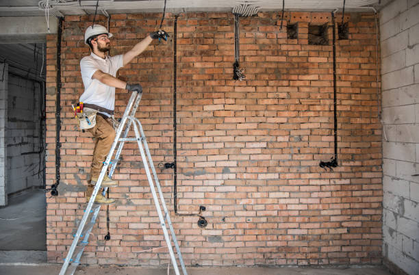 istock Electrician with tools, working on a construction site. Repair and handyman concept. 1180814594