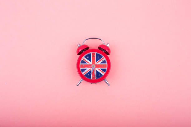 English clock with the colors of the British flag. Time to learn English. English clock with the colors of the British flag. Time to learn English.-Image London Memorabilia stock pictures, royalty-free photos & images