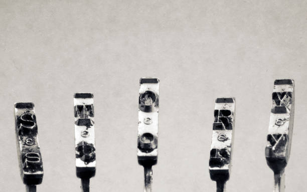 istock old typewriter hammers and the word STORY 1180815523