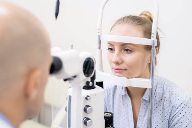 istock Young woman having her eyesight checked by special optometric equipment 1180815535