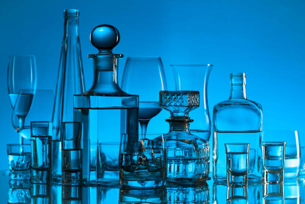 istock Glassware and alcoholic beverages on a glass table. 1180817485