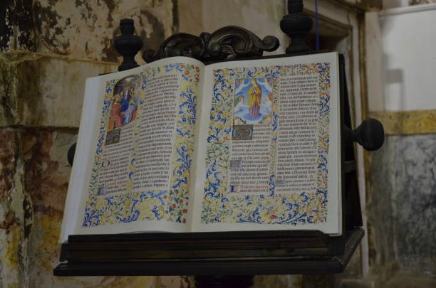 altes mittelalterliches buch in einer kirche - manuscript stock-fotos und bilder