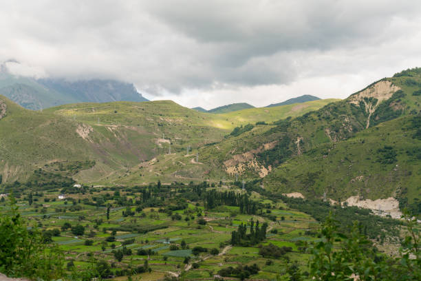 istock beautiful mountain landscape bright Sunny day with blue sky and white clouds 1180825339