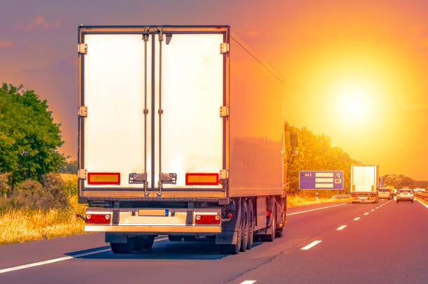 istock Truck with container on highway, cargo transportation concept. 1180826220