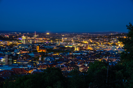Germany, Night lights of illuminated skyline and cityscape of downtown stuttgart city, aerial view from above by night