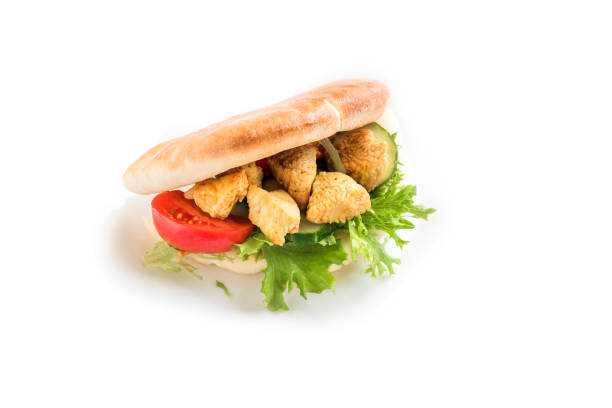 Chicken Tikka Naan Sandwich. Indian Flatbread sandwich with chicken and vegetables, isolated on white, copy space.