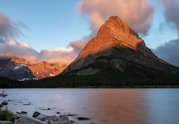 istock Sun Rise and Smooth Water In Many Glacier 1180828515