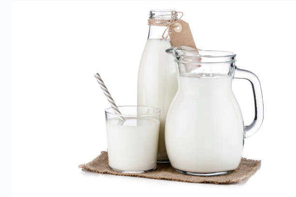istock Milk bottle, jug and glass isolated on white background 1180828797