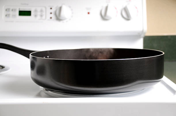 istock Smoke from a Hot Skillet on  White Stove 118082984