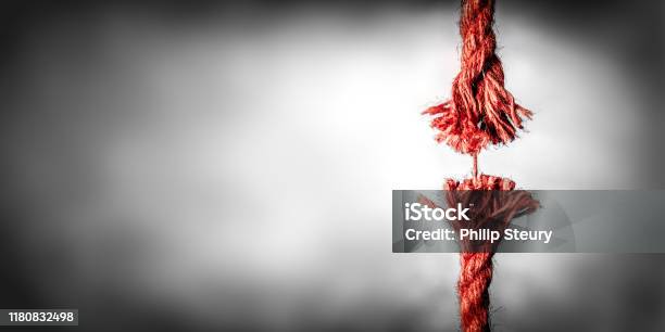 Frayed Red Rope Hanging By Last Thread Stock Photo - Download Image Now - Rope, Frayed, String