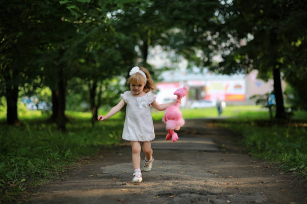 istock Mom with two daughters twins 1180833622