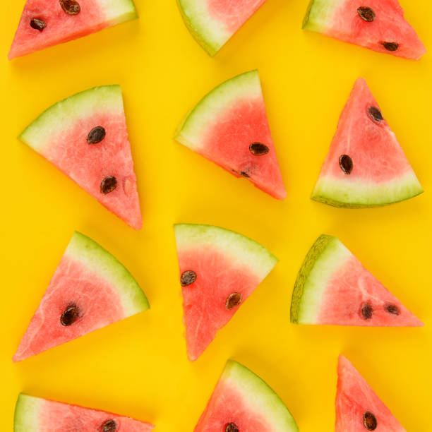 istock Sliced ripe juicy watermelon on a bright yellow background 1180833951