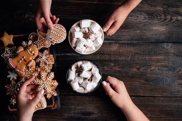 istock Friends eating festive sweets with hot chocolate 1180834302