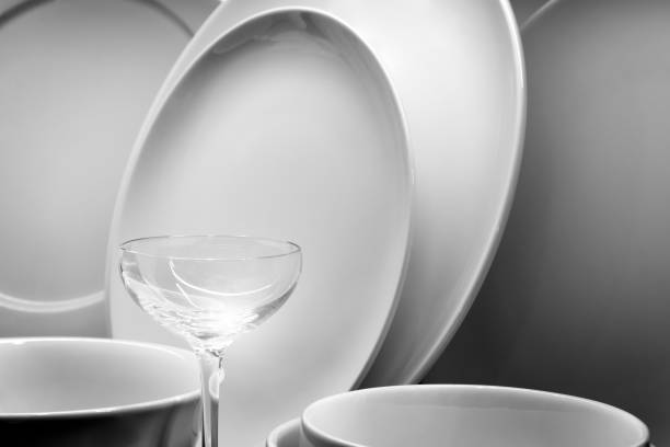 istock White tableware for serving. Crockery,dish, utensils and other different white stuff on white table-top. Kitchen still life. Copy space. 1180834351