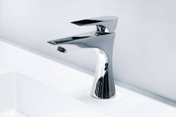 istock Luxury mixer on a white sink in a beautiful gray bathroom 1180835333