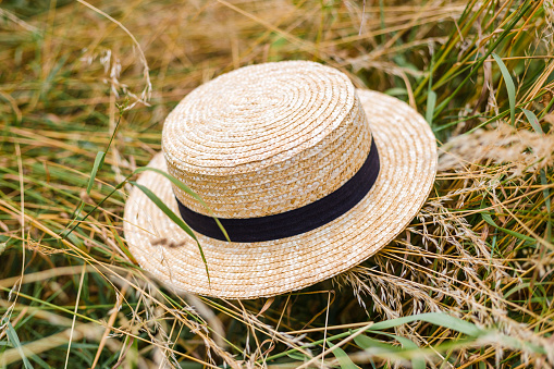 Rustic background. Nature background with straw boater hat