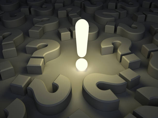 istock Exclamation mark light bulb glowing among many question marks in the dark night background idea concept 1180836518